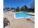 Inviting pool area featuring lounge chairs, seating, and a sparkling blue pool at 2746 S Kenton Ct, Aurora, CO 80014