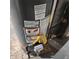Water heater with visible gas lines, installation, and safety labels at 2746 S Kenton Ct, Aurora, CO 80014