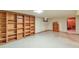 Spacious basement with open shelving and tile flooring at 1304 S Harlan St, Lakewood, CO 80232
