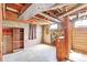 Unfinished basement featuring open ceiling and concrete walls at 1304 S Harlan St, Lakewood, CO 80232