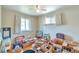 Bedroom with hardwood floors and natural light, currently with packed boxes at 1304 S Harlan St, Lakewood, CO 80232