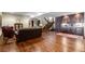Finished basement featuring hardwood floors, a wet bar, and comfortable seating areas at 9617 S Shadow Hill Cir, Lone Tree, CO 80124