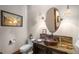 Elegant powder room with decorative mirror, copper sink, and custom vanity at 9617 S Shadow Hill Cir, Lone Tree, CO 80124