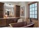 A copper standalone tub is featured in a bathroom with dark wood cabinets and granite countertops at 9617 S Shadow Hill Cir, Lone Tree, CO 80124