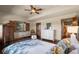 Comfortable bedroom with hardwood floors, window shutters, and ample closet space at 9617 S Shadow Hill Cir, Lone Tree, CO 80124