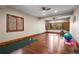 Bright exercise room with hardwood floors, natural light, and ample space for workout equipment at 9617 S Shadow Hill Cir, Lone Tree, CO 80124