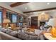 Living room features hardwood floors, fireplace, and a large window with wood trim at 9617 S Shadow Hill Cir, Lone Tree, CO 80124