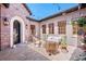 Charming outdoor patio with comfortable seating, string lights, decorative plants, and brick pavers at 9617 S Shadow Hill Cir, Lone Tree, CO 80124