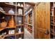 Walk in pantry with custom shelving and wine storage at 9617 S Shadow Hill Cir, Lone Tree, CO 80124