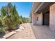 Covered brick patio with ample space for outdoor seating and entertaining at 9617 S Shadow Hill Cir, Lone Tree, CO 80124