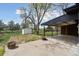 Backyard with patio, shed, and garden area, offering outdoor living at 2840 Cottonwood Dr, Denver, CO 80221