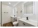 Bright bathroom featuring a double vanity, subway tile, and modern fixtures at 2840 Cottonwood Dr, Denver, CO 80221