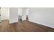 Bedroom with hardwood floors and access to the bathroom at 2840 Cottonwood Dr, Denver, CO 80221