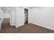 Bedroom featuring neutral carpet, and a large closet space at 2840 Cottonwood Dr, Denver, CO 80221