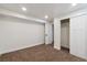 Bedroom featuring neutral carpet, and a large closet space at 2840 Cottonwood Dr, Denver, CO 80221