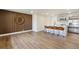 Modern kitchen featuring a large island with bar seating, stainless steel appliances, and stylish finishes at 2840 Cottonwood Dr, Denver, CO 80221