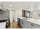 Open-concept kitchen with stainless steel appliances, a pantry, and a large center island at 2840 Cottonwood Dr, Denver, CO 80221