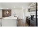 Spacious kitchen featuring an island, stainless steel appliances, and modern finishes at 2840 Cottonwood Dr, Denver, CO 80221