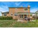 View of backyard with a covered patio featuring outdoor seating and a grill at 2954 E 101St Ave, Thornton, CO 80229