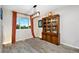 Cozy dining room with an antique wooden cabinet and modern lighting fixture at 2954 E 101St Ave, Thornton, CO 80229