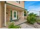 Charming front porch with stone accents, manicured plants and a cozy sitting area at 2954 E 101St Ave, Thornton, CO 80229