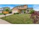 Charming two-story home with well-maintained lawn and beautiful landscaping at 2954 E 101St Ave, Thornton, CO 80229