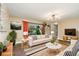 Inviting living room featuring stylish furnishings, natural light, and an open layout at 2954 E 101St Ave, Thornton, CO 80229