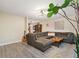Spacious living room with modern decor, featuring a large sectional sofa and a stylish rug at 2954 E 101St Ave, Thornton, CO 80229