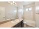 Well lit bathroom with a wide mirror, sink, and shower-tub combo at 4672 Basalt Ridge Cir, Castle Rock, CO 80108