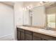 Bright bathroom boasting a large double vanity with modern fixtures and ample lighting at 4672 Basalt Ridge Cir, Castle Rock, CO 80108