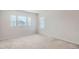 Spacious bedroom with neutral carpeting and multiple windows offering ample natural light at 4672 Basalt Ridge Cir, Castle Rock, CO 80108
