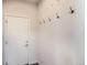 Clean entryway with a white door and coat hooks for organization at 4672 Basalt Ridge Cir, Castle Rock, CO 80108
