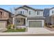 Charming two-story home featuring a gray exterior, a two-car garage, and a manicured front lawn at 4672 Basalt Ridge Cir, Castle Rock, CO 80108