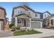 Inviting two-story home with stone accents, a two-car garage, and well-maintained landscaping at 4672 Basalt Ridge Cir, Castle Rock, CO 80108