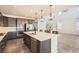 Modern eat-in kitchen featuring an island, stainless appliances, and seamless open floor design at 4672 Basalt Ridge Cir, Castle Rock, CO 80108