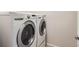 LG washer and dryer combo with stainless steel accents in a dedicated laundry room at 4672 Basalt Ridge Cir, Castle Rock, CO 80108