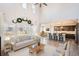 Bright living room featuring a soaring ceiling, modern decor, and an open floor plan, perfect for gatherings at 4672 Basalt Ridge Cir, Castle Rock, CO 80108
