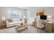 Bright living room with large windows, couch, chair, and desk at 4672 Basalt Ridge Cir, Castle Rock, CO 80108