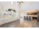 Bright, open-concept living space connecting a modern living room with an eat-in kitchen area at 4672 Basalt Ridge Cir, Castle Rock, CO 80108