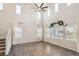 Spacious living room with high ceilings, large windows, hardwood floors, and modern decor at 4672 Basalt Ridge Cir, Castle Rock, CO 80108