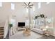 Inviting living room with a high ceiling, large windows, and stylish furniture, creating a cozy atmosphere at 4672 Basalt Ridge Cir, Castle Rock, CO 80108