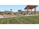 Community playground with slides, climbing structures, and picnic tables at 4672 Basalt Ridge Cir, Castle Rock, CO 80108