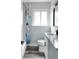 Cozy bathroom with modern fixtures, new vanity and black faucet, and decorative shower curtain at 1345 Holly St, Denver, CO 80220