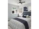 Bright bedroom boasting lots of natural light, neutral décor, and a ceiling fan at 1345 Holly St, Denver, CO 80220