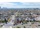 Scenic aerial view of a residential area with houses, trees, and the city skyline in the background at 3311 N York St, Denver, CO 80205