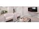 Finished basement featuring a comfortable seating area, neutral tones, and plush carpeting at 3311 N York St, Denver, CO 80205