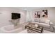 Basement living room showcasing a sofa, modern decor, and an open floor plan at 3311 N York St, Denver, CO 80205