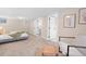 Basement bedroom features carpet, ensuite bathroom, and chair with ottoman at 3311 N York St, Denver, CO 80205