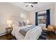 Comfortable bedroom with large windows, offering plenty of natural light, hardwood floors at 3311 N York St, Denver, CO 80205
