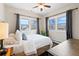 Cozy bedroom with bright windows and ceiling fan, offering a relaxing space at 3311 N York St, Denver, CO 80205